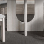 5pc dining set with gray upholstered chairs and round table.