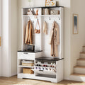 6-in-1 hall tree with white wood grain, black accents, coat hooks, bench, drawer, and tilt-out shoe storage cabinet.
