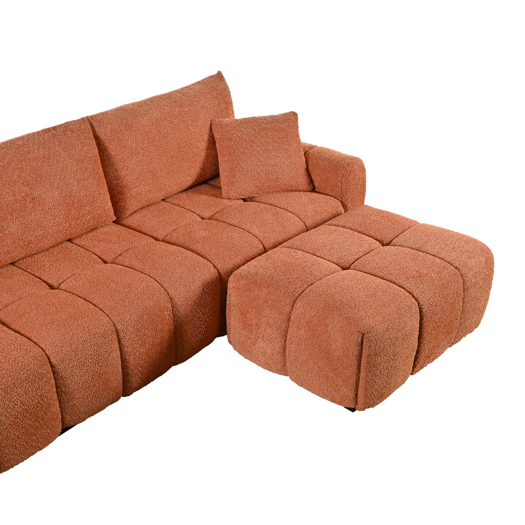 Angled view of modular sectional sofa with ottoman in boucle fabric, highlighting plush cushions and flexible seating arrangement.