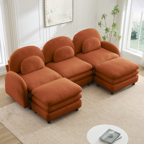 Orange teddy fabric 3-seater sectional sofa with a curved back, lumbar pillows, and two movable ottomans.