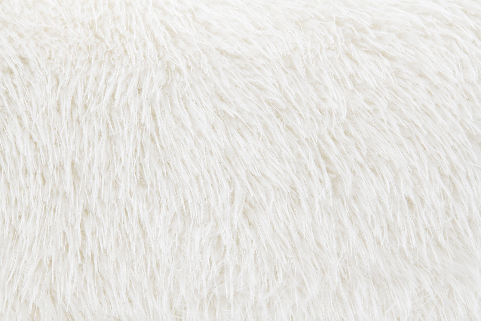 Close-up of white faux fur texture on Contemporary Swivel Chair. Soft, plush material adds luxury to modern interiors.