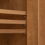 Adjustable shelf pegs inside rattan shoe cabinet allow customization of shelf height. Flexible shoe organizer for various shoe sizes.