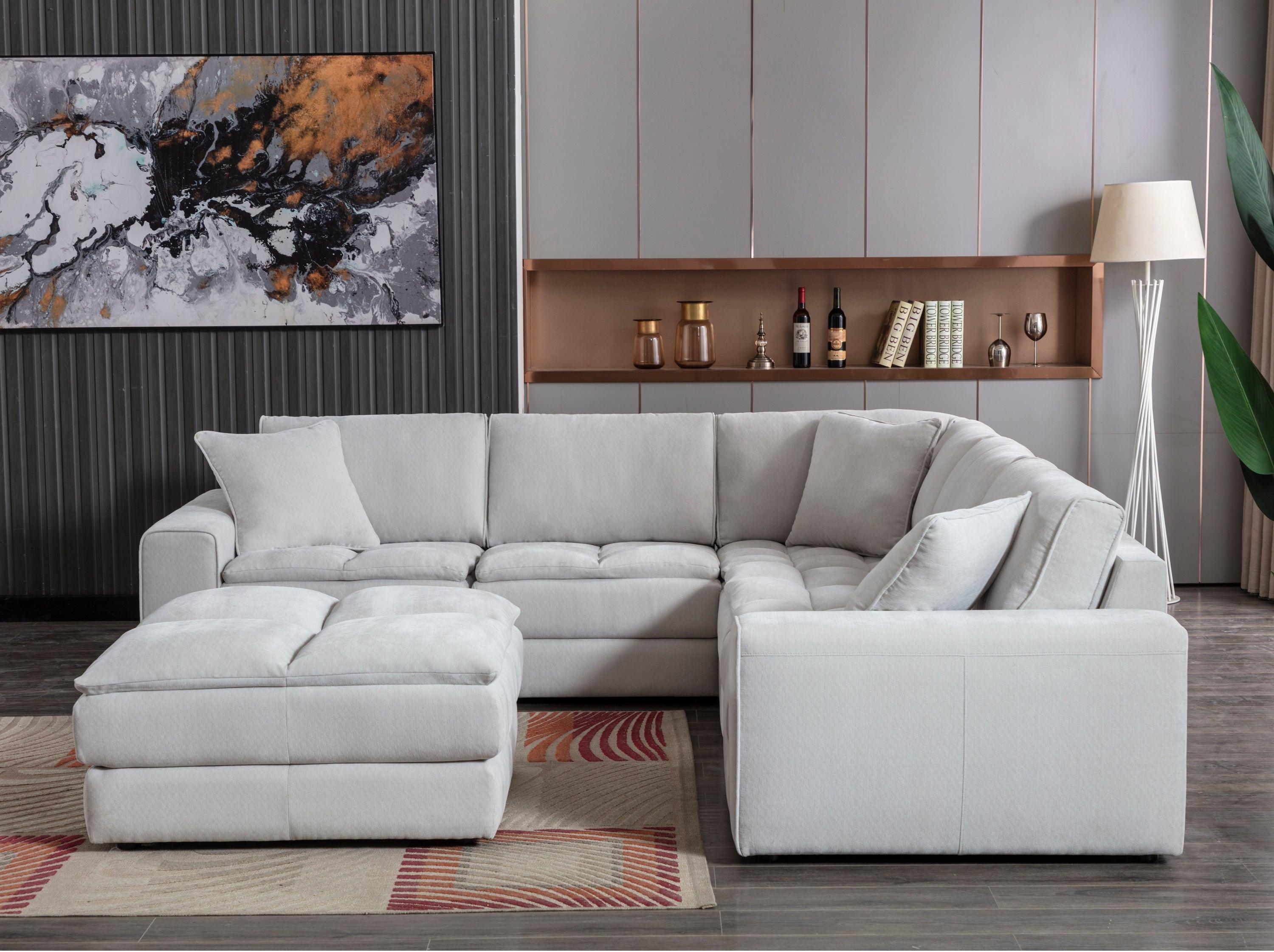 Breton Modular Sectional Sofa with Ottoman in Oyster Grey.