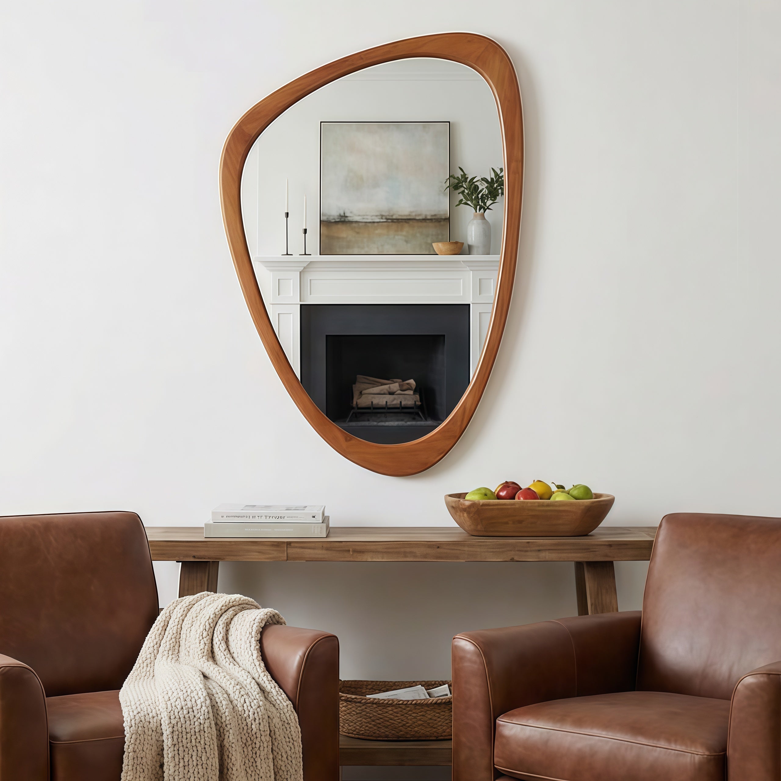 Irregular, amoeba-shaped decorative mirror with a warm, yellowish-brown solid wood frame, wall-mounted above a console.