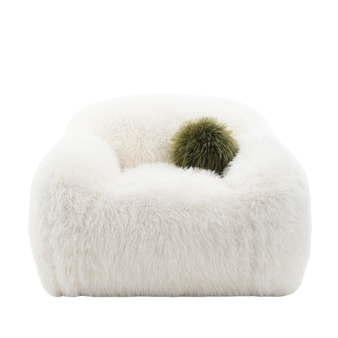 Contemporary White Swivel Chair with green ball pillow. Features plush faux fur and rounded design for cozy, modern seating.