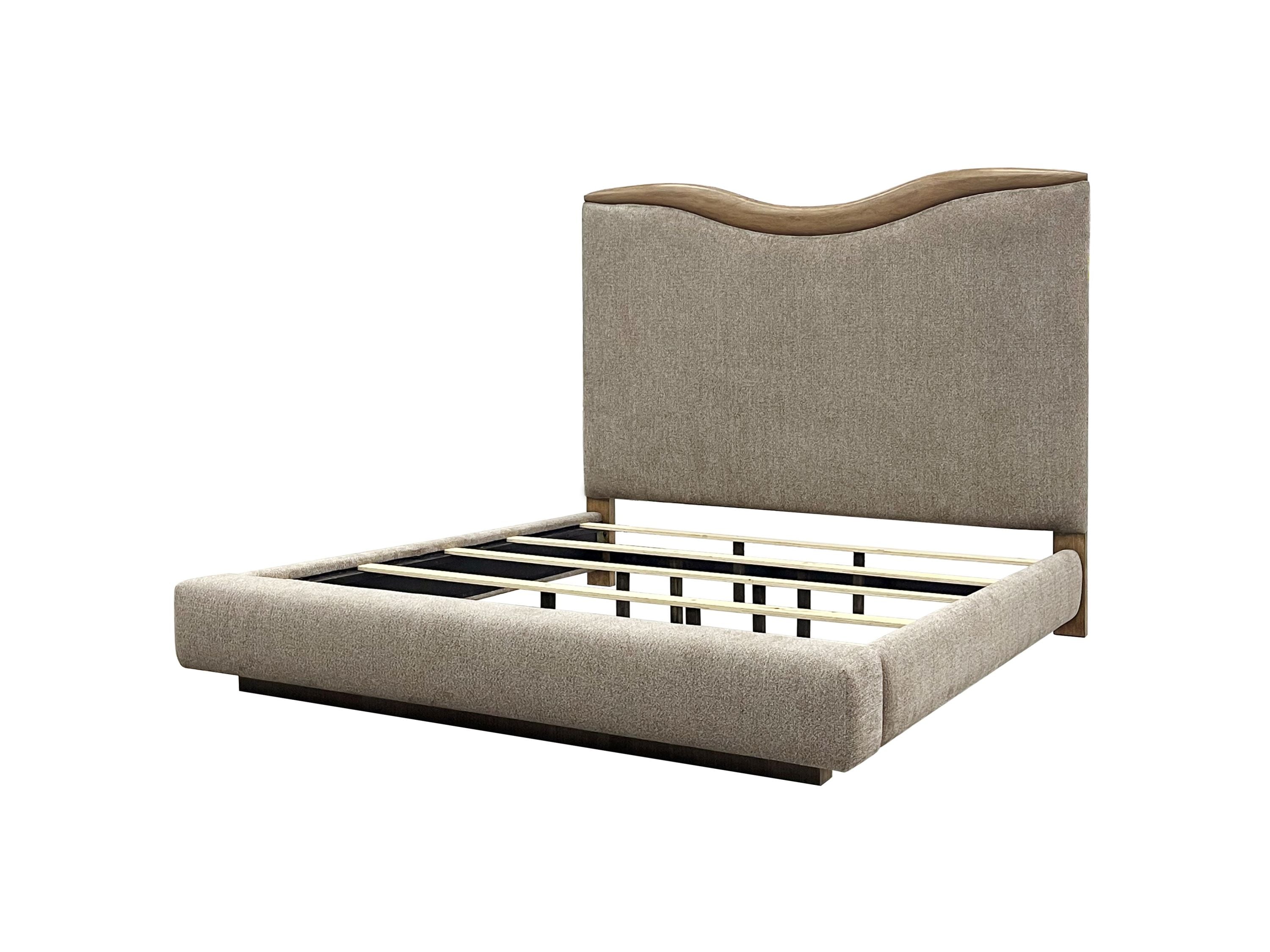Upholstered queen bed frame with curved headboard and slatted base, showcasing durable platform construction in neutral fabric and wood.