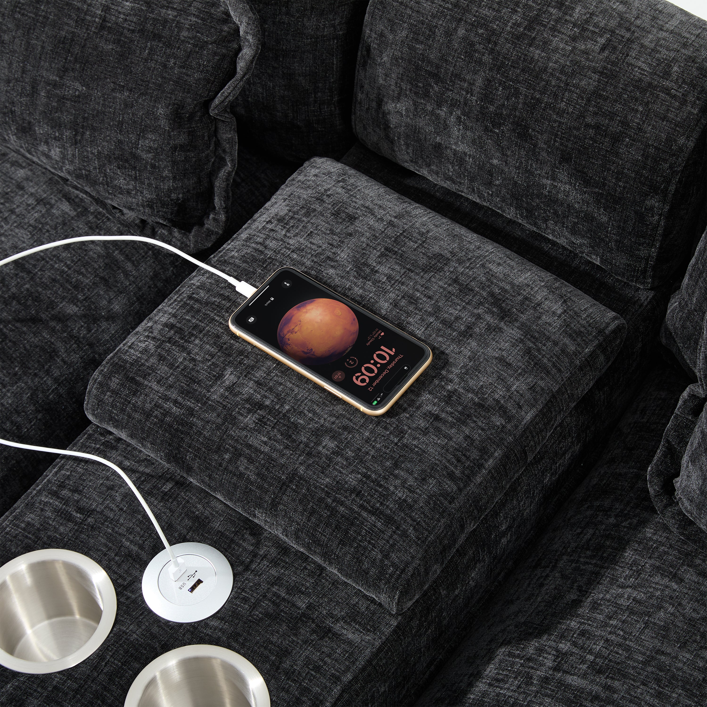 Close-up of USB charging port in use on Modern U-Shaped Sectional Sofa with Console & USB, highlighting tech-friendly features.