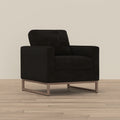 Modern black fabric accent chair with a boxy silhouette and a minimalist wood-tone metal sled base.