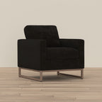 Modern black fabric accent chair with a boxy silhouette and a minimalist wood-tone metal sled base.