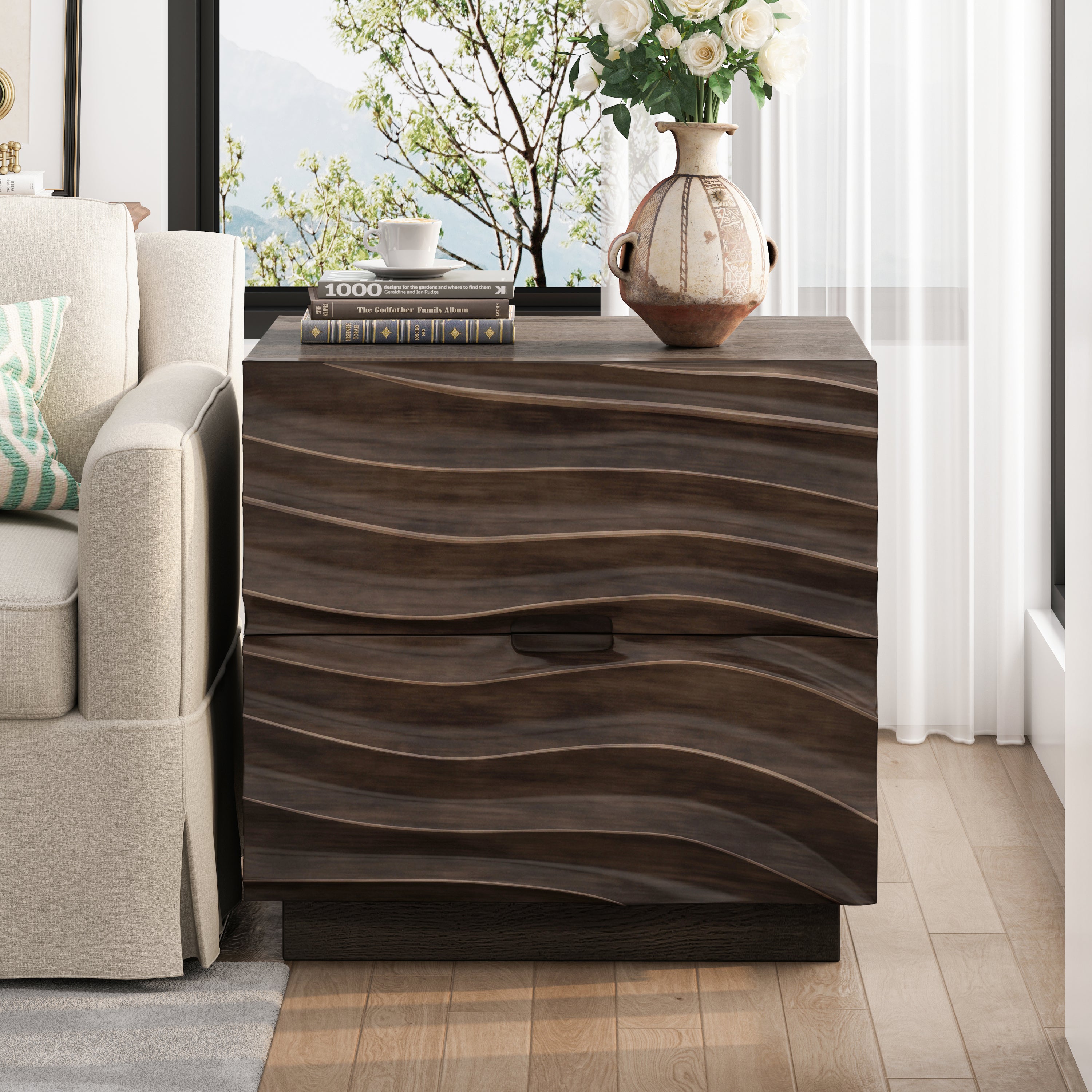 Modern brown solid wood nightstand with two drawers featuring a wavy textured front, standing next to a beige sofa.
