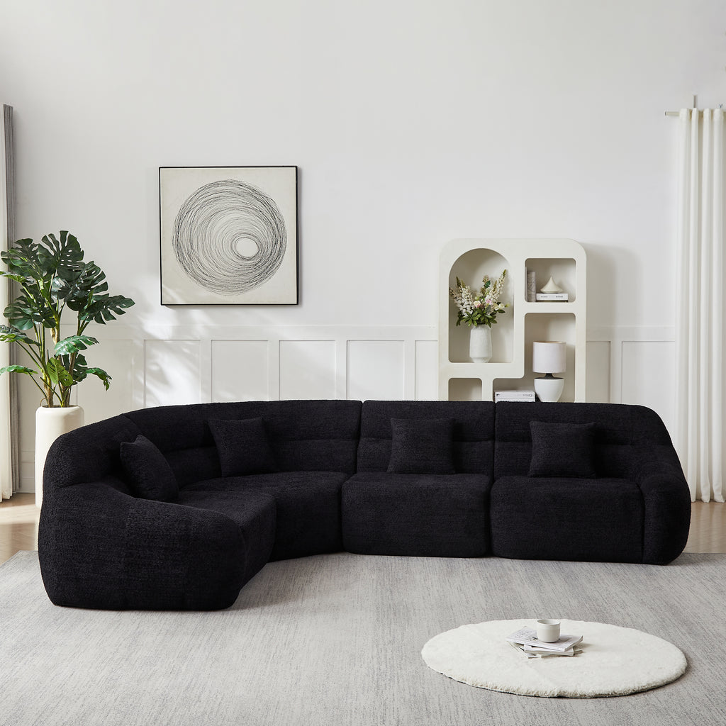 Modern Black Modular Sofa in chenille fabric, 4-seater with curved backrest and plush cushions, styled in a contemporary living room.