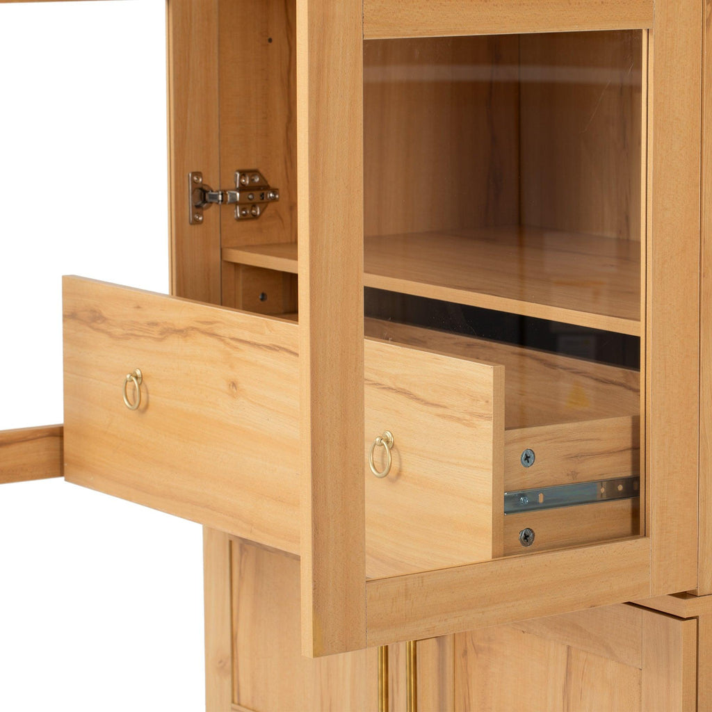 Drawer partially open inside upper section of arched kitchen pantry cabinet, showing smooth glide mechanism and storage space.
