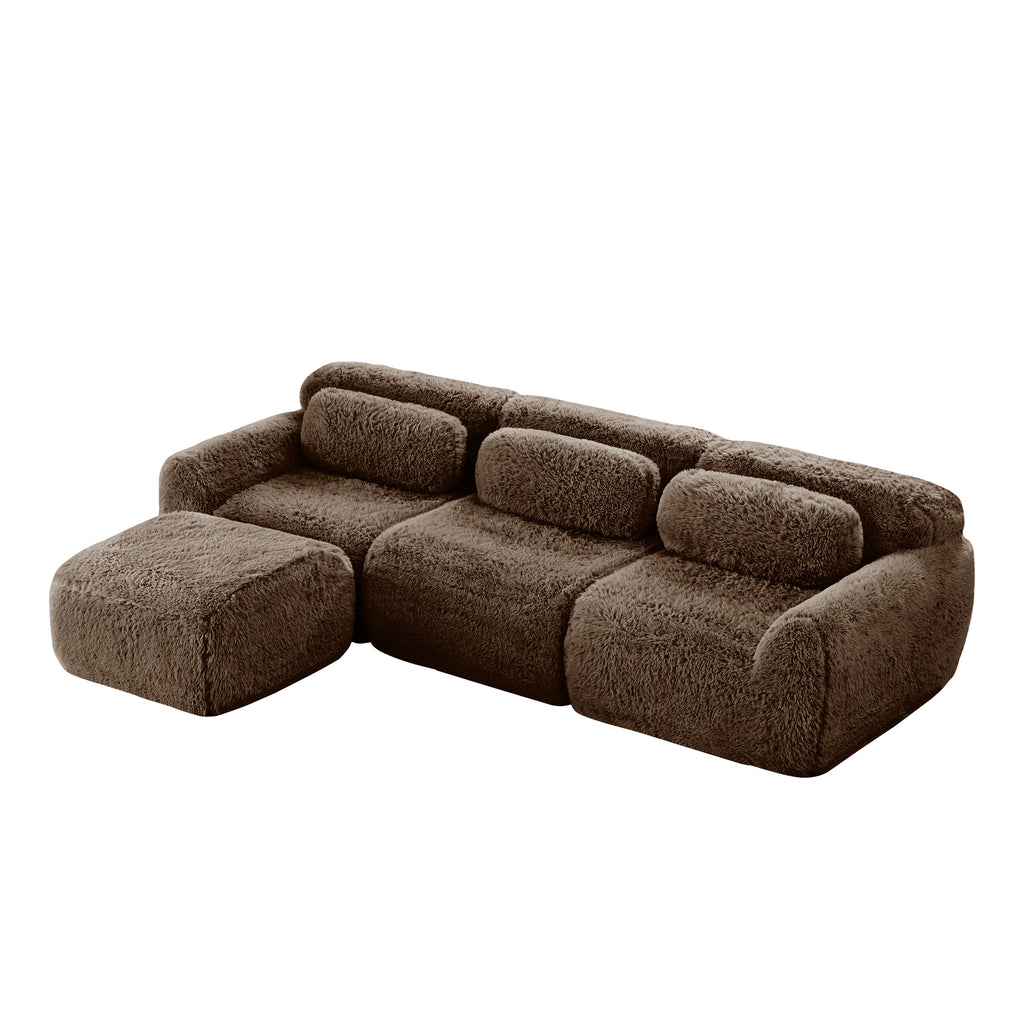 Chocolate plush modular sofa with three seats and movable ottoman, designed for flexible living room arrangements and comfort.