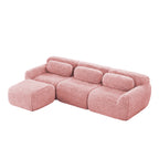 Plush modular sofa in soft pink with throw pillows and movable ottoman, featuring ergonomic design and no assembly required.