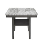 Front view of Selena Dining Table featuring gray faux marble top and sturdy black legs with storage shelf underneath.