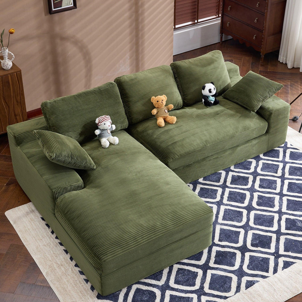 Green Corduroy Sofa with Cushions and Pillows.