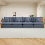 Blue corduroy sofa with modular design placed in a stylish living room. Offers four spacious seats and cozy pillows for comfort and style.