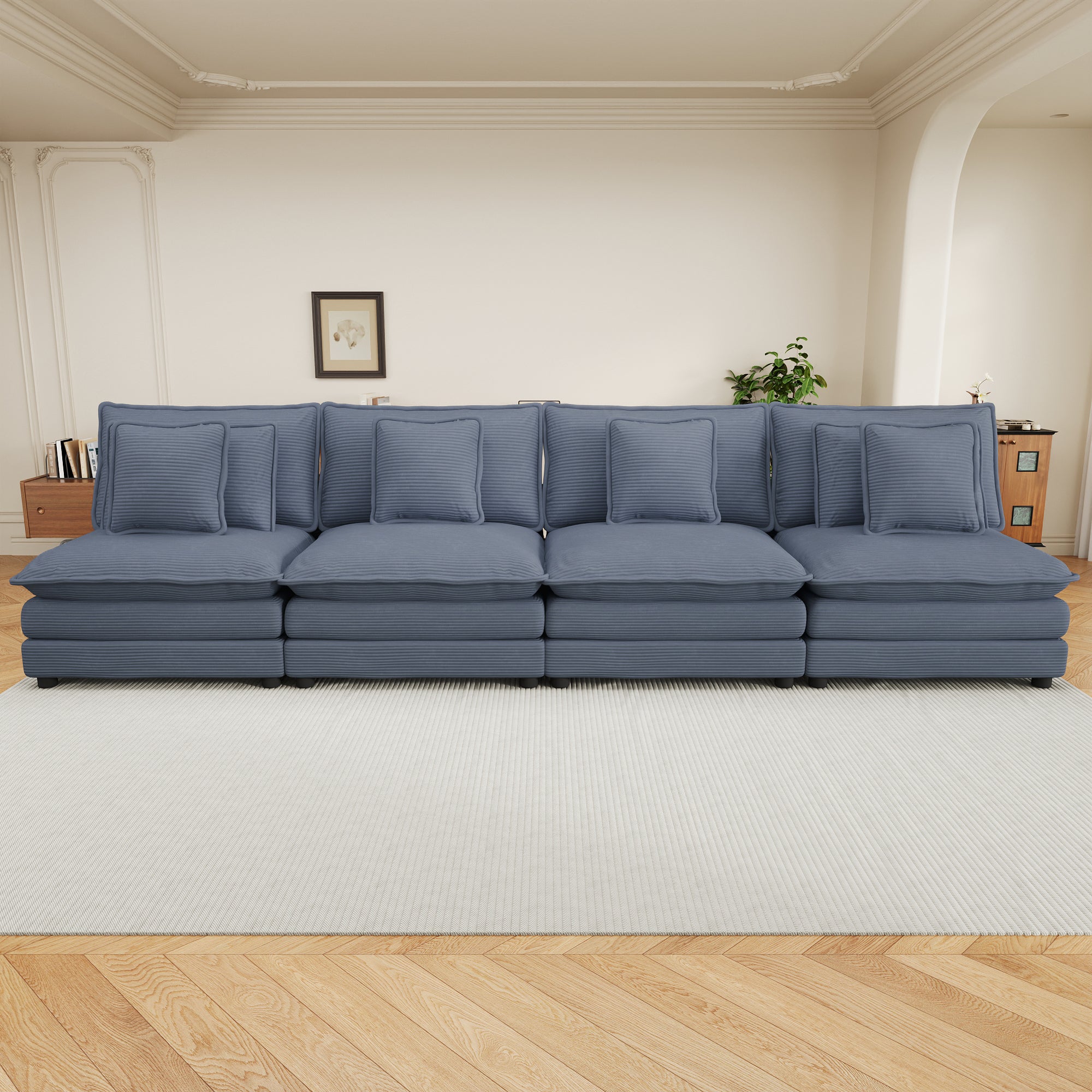 Blue corduroy sofa with modular design placed in a stylish living room. Offers four spacious seats and cozy pillows for comfort and style.