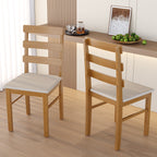 Pair of solid wood dining chairs with cushioned seats in a modern kitchen. Features ergonomic backrest and sturdy build.