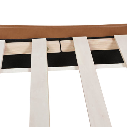 Close-up of wooden slats and black frame support on Aspen king faux leather platform bed for enhanced mattress stability.