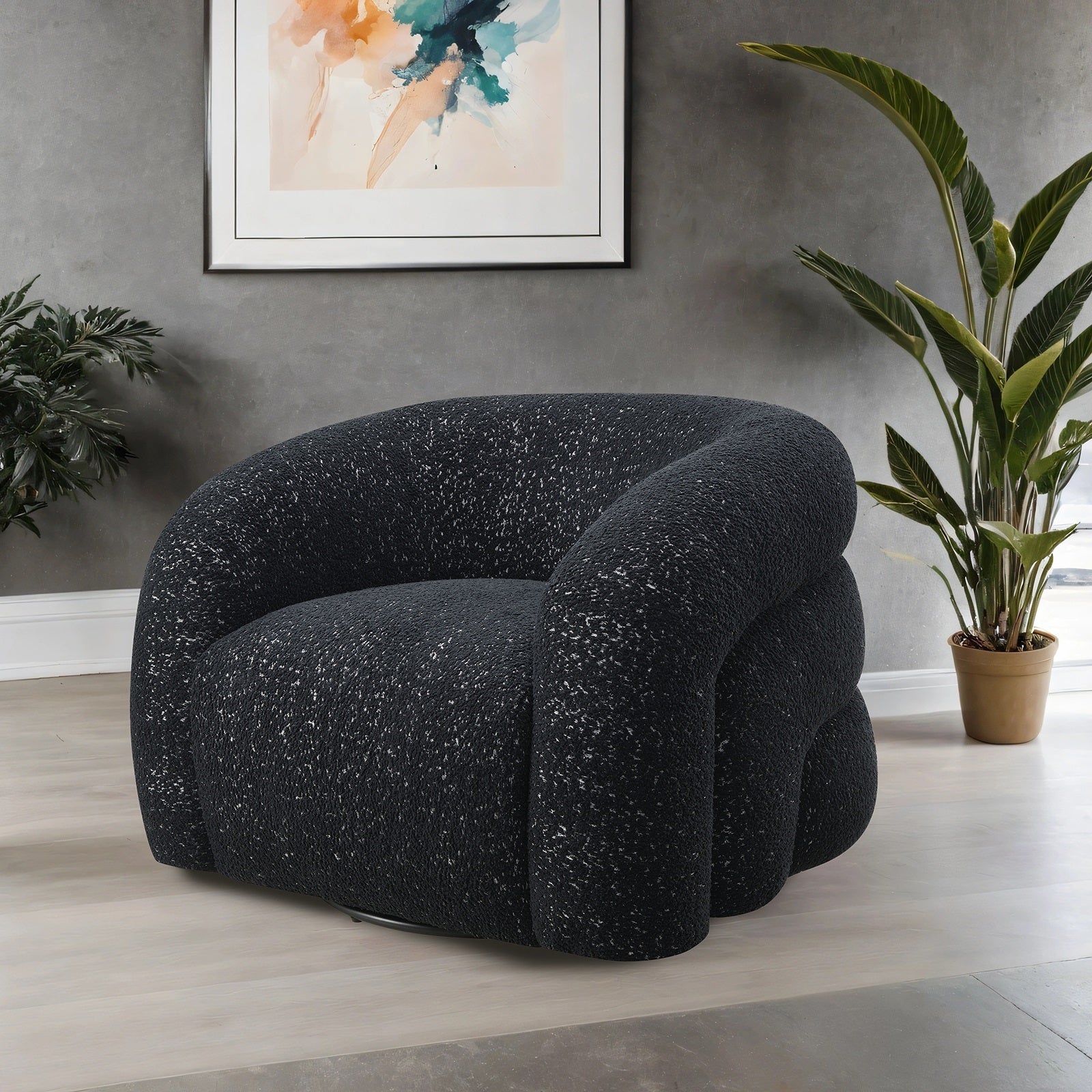 Modern black swivel chair with boucle fabric and curved back in stylish room setting. Offers 360-degree rotation and plush comfort.