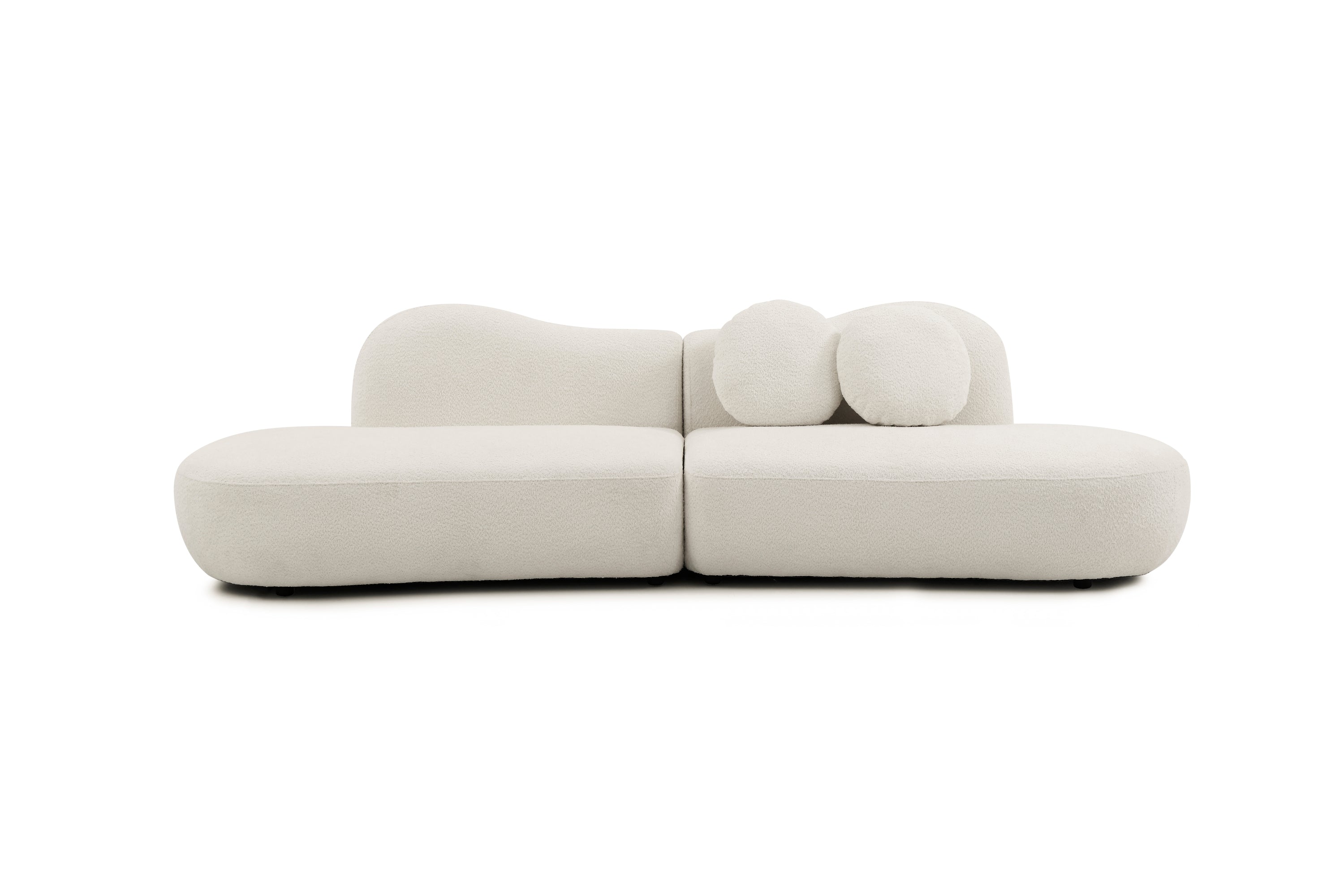 Front view of modern curved sofa in boucle fabric, featuring modular sections and artistic backrest for stylish living rooms or bedrooms.