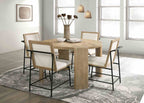 Set of four Oak Beige Dining Chairs around a round wood dining table in a bright, modern room with large windows and pendant lighting.