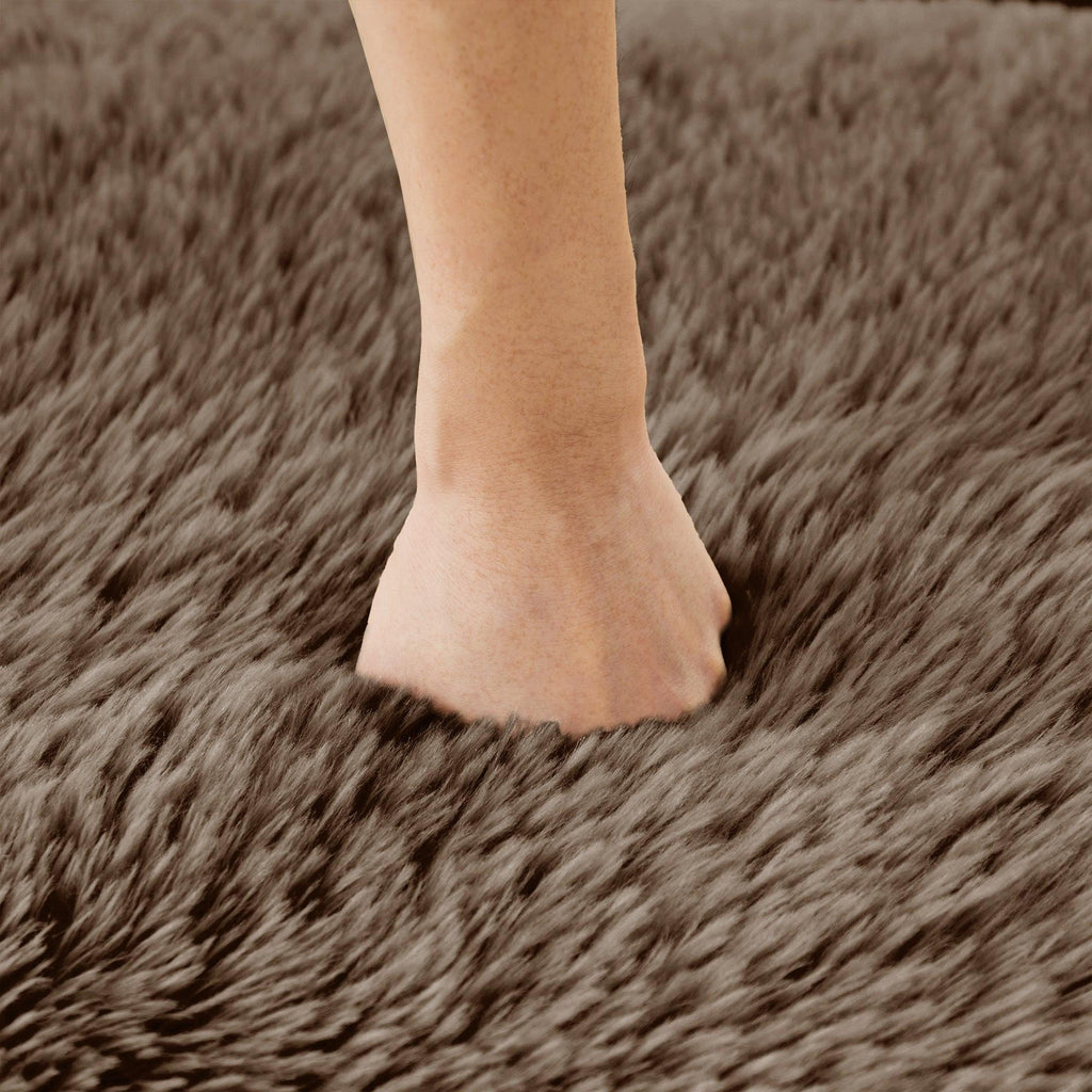 Hand pressing into the soft faux fur of Modular Sofa - Plush, No Assembly | 80'' Fabric, Anti-Slip, demonstrating its high-resilience foam.