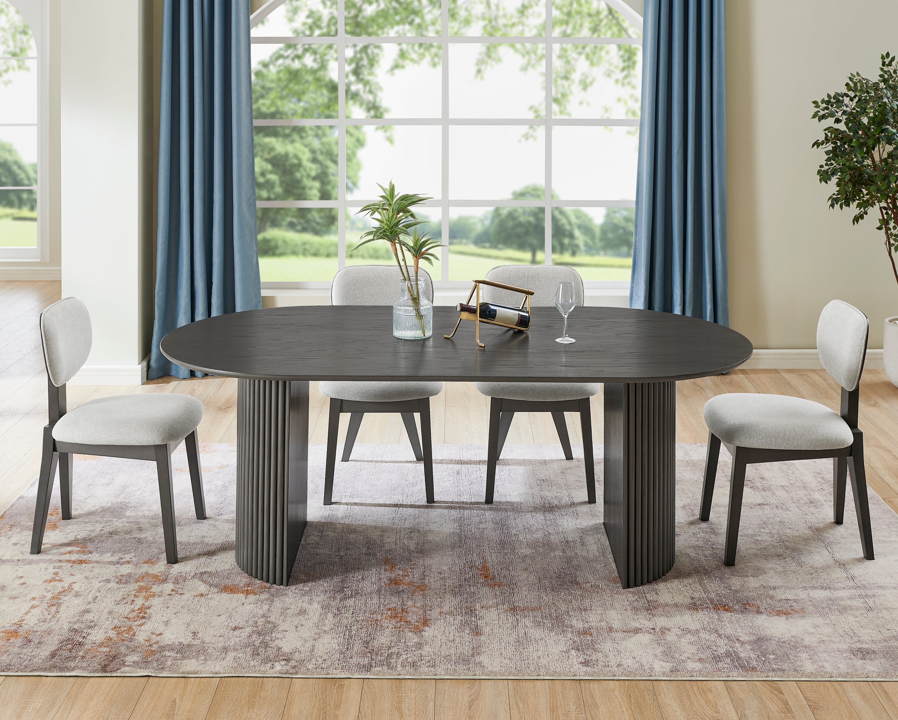 Oval Gray Oak Dining Set - Seats 6 in a modern dining room with upholstered chairs and dual pedestal base, perfect for stylish family meals.