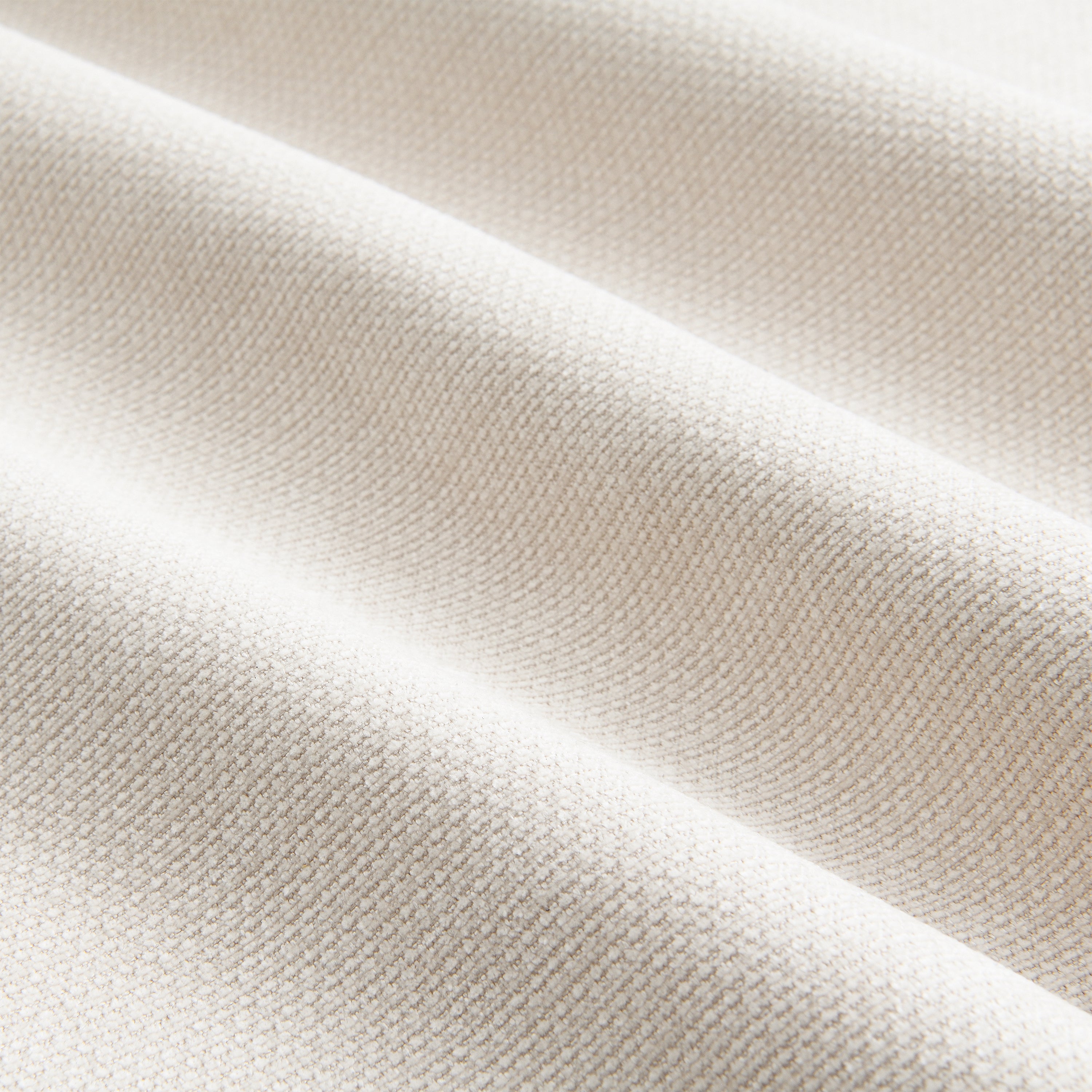 Close-up texture of high-quality chenille fabric used in the modular sectional sofa with ottoman, soft and breathable.