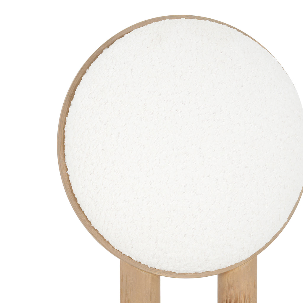 Close-up of circular polyester backrest with natural wood trim, part of a modern dining chair set.