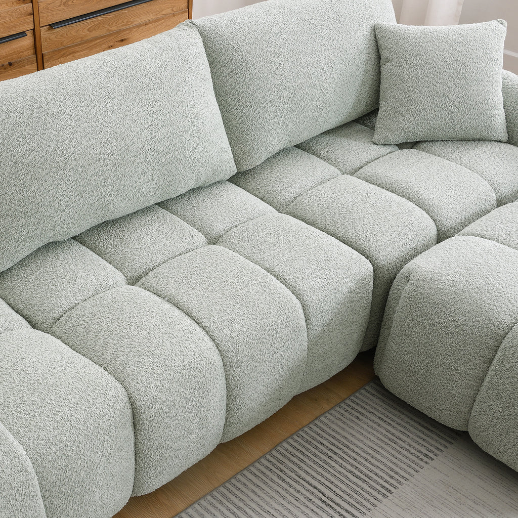 Top view of modular sectional sofa with ottoman showing plush seating and cushion arrangement for maximum comfort.