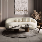 Curvy ivory boucle sofa in Japandi style, featuring a rounded silhouette and plush texture in a modern living room.