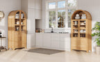 Pair of arched kitchen pantry cabinets in a bright kitchen, offering symmetrical and ample storage for cookware and pantry items.
