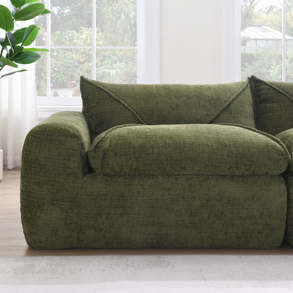 Detail of single seat on 116'' compressed sofa in green, emphasizing plush high density foam and soft, durable upholstery.