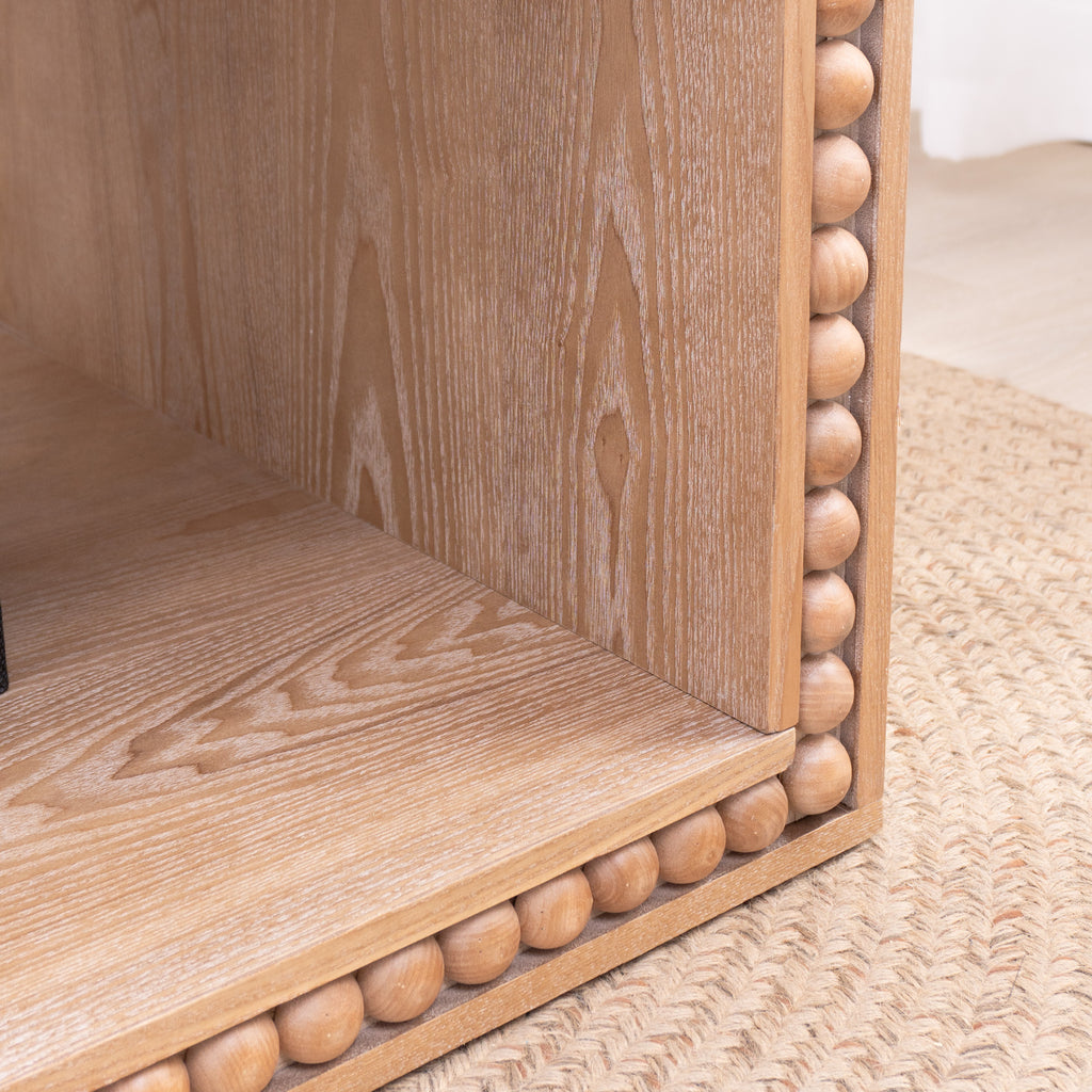 Detail of beaded edge craftsmanship on the Rustic Coffee Table, emphasizing wood texture and carved trim design.