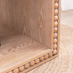 Detail of beaded edge craftsmanship on the Rustic Coffee Table, emphasizing wood texture and carved trim design.