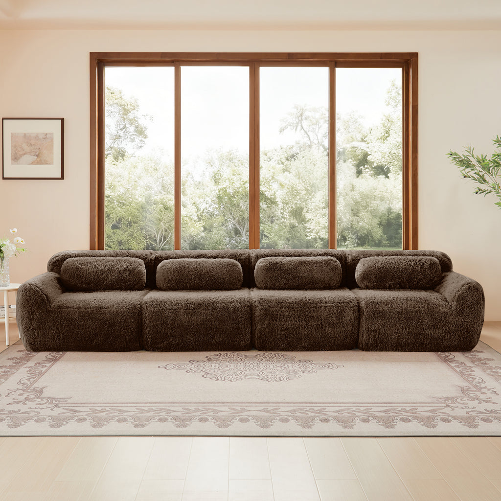 Front view of modular chocolate plush sofa with four seats, showcasing its cozy, seamless design and plush fabric for home interiors.