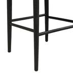 Close-up of black bar stool legs and footrest, highlighting sturdy rubberwood construction and sleek tapered design.