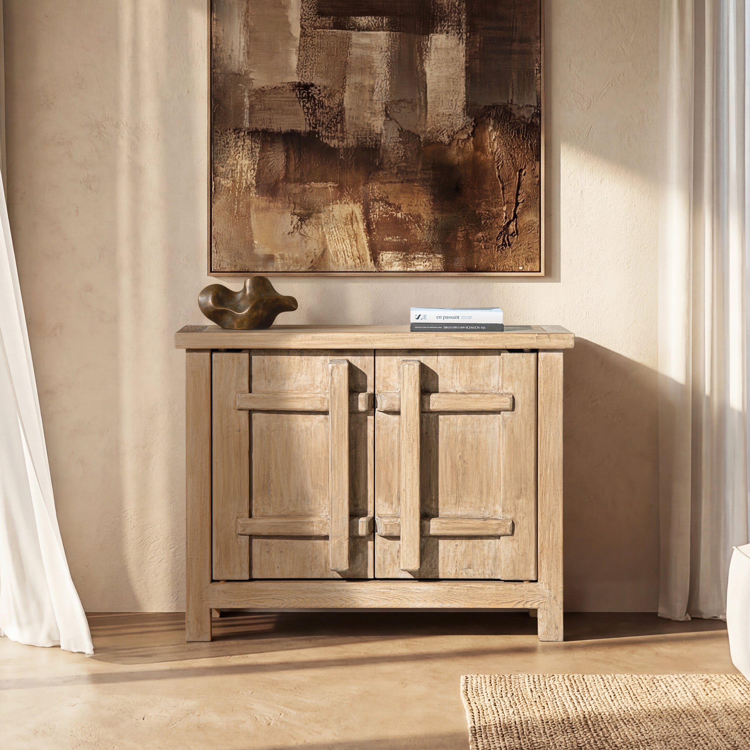 Light natural brown reclaimed pine storage cabinet with two doors featuring a distinctive vertical crossbar design.