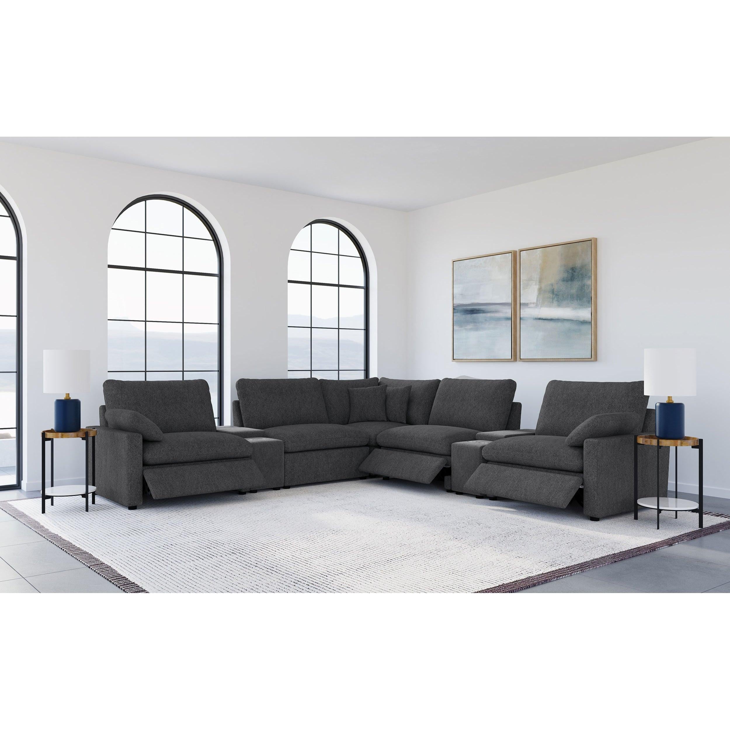 Modular Power Reclining Sectional in Dark Grey Fabric.