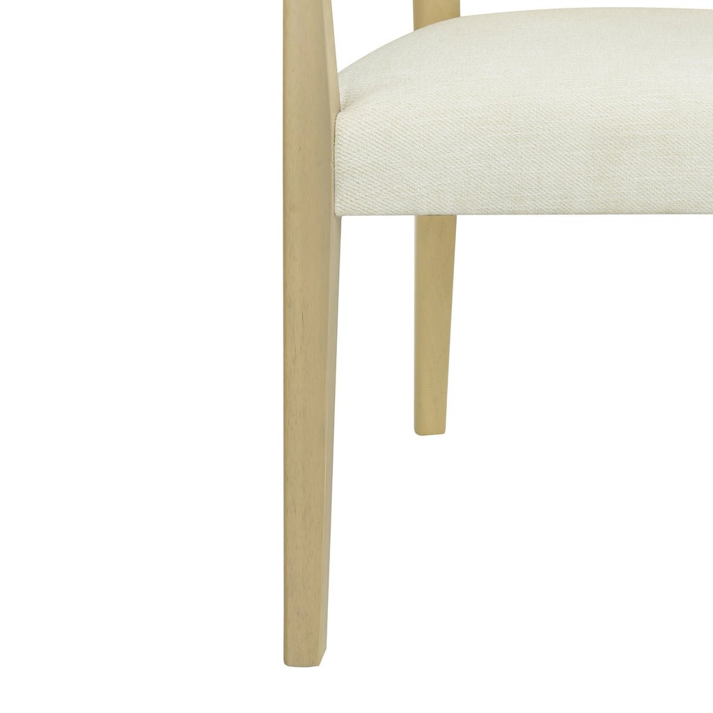 Close-up of chair leg and seat corner, highlighting the smooth wood finish and tightly upholstered foam cushion.
