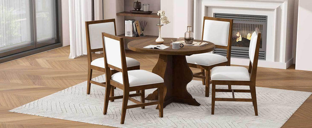 Farmhouse dining table set with round wooden table and four white upholstered chairs in a cozy dining room. Stylish and practical for family meals.