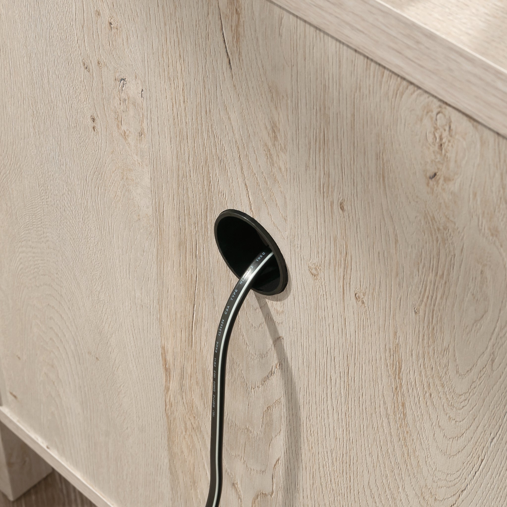 Back view of Gray Night Stand with Drawer showing built-in cable management hole for organized electronics storage.