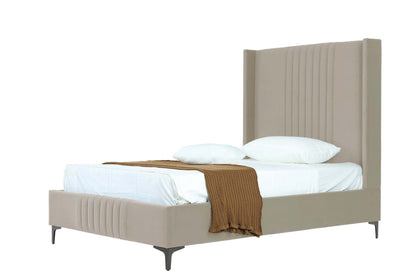 Three-quarter view of Promenade Upholstered Velvet Bed Frame 48' in Rustic Taupe with mattress, pillows, and brown knit throw.