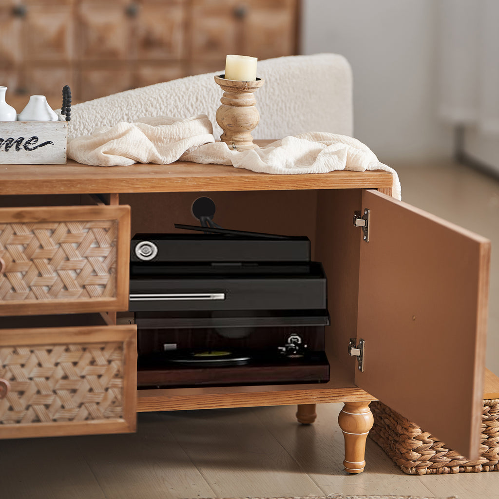 Boho TV Console with adjustable shelves and cord management, showing interior storage for electronics behind rattan cabinet doors.