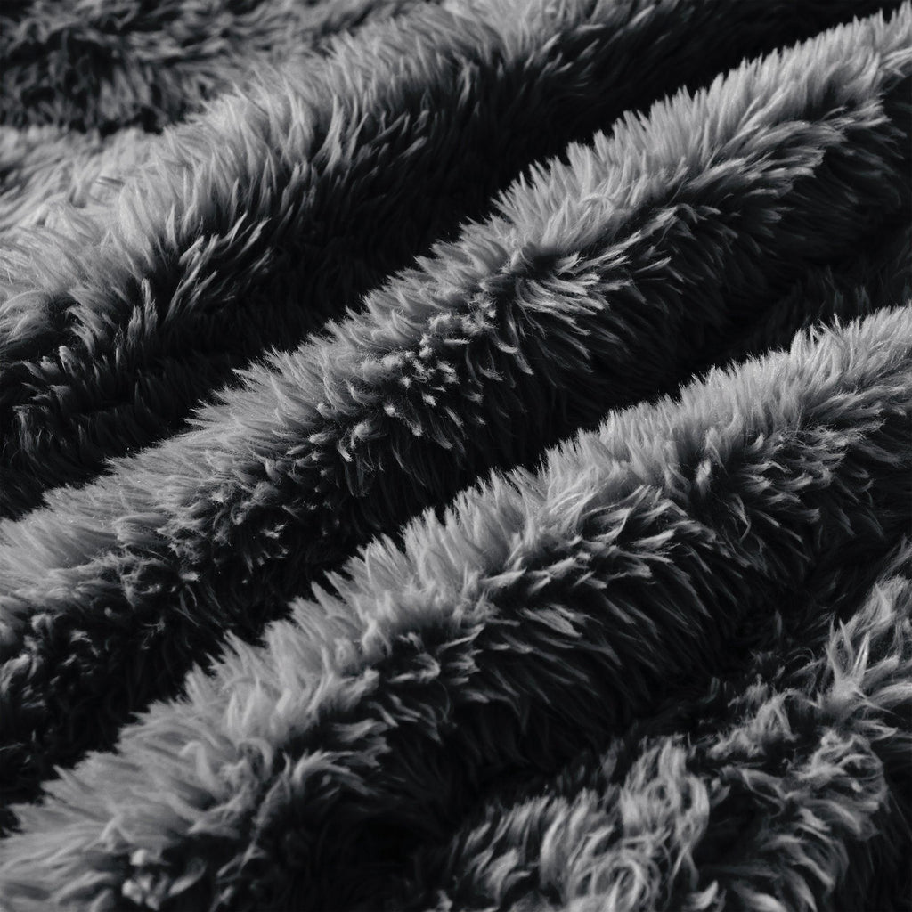 Close-up of dark grey plush fabric on Modular Sofa, showcasing its soft, high-pile texture. Made for comfort and luxury.