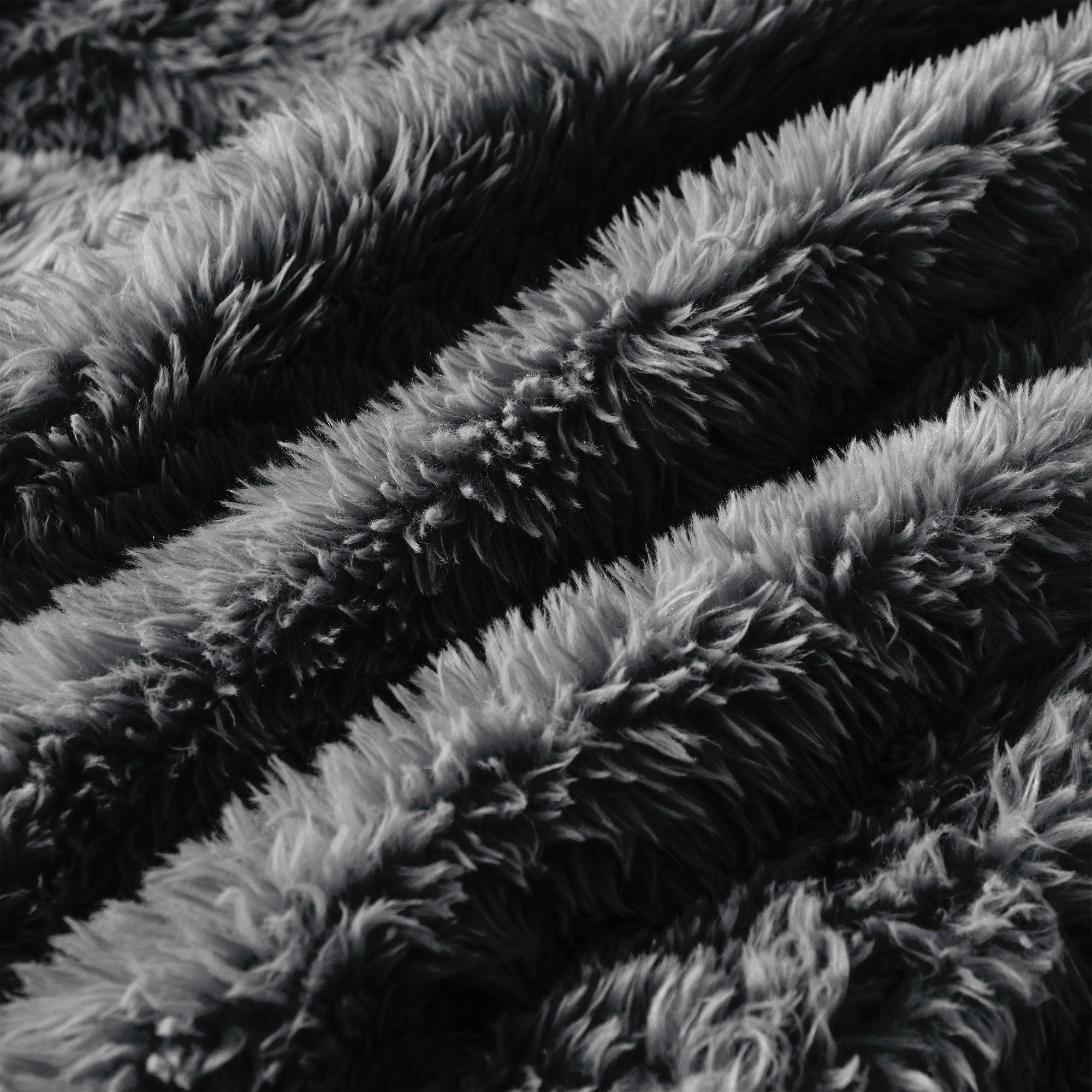 Close-up of dark grey plush fabric on Modular Sofa, showcasing its soft, high-pile texture. Made for comfort and luxury.