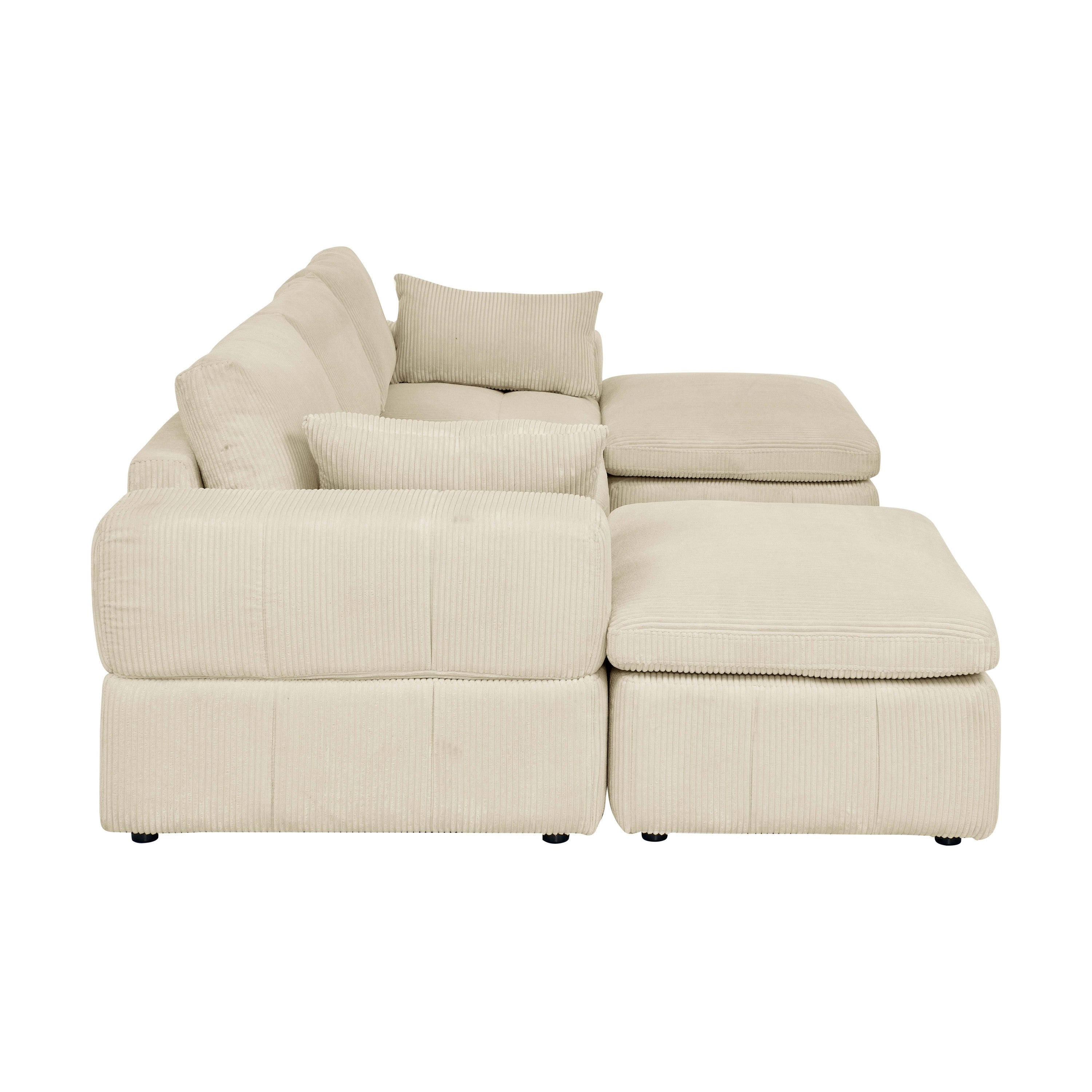 Side profile of corduroy sectional with ottomans and large arms. Upholstered in soft beige fabric with a modern, modular design.