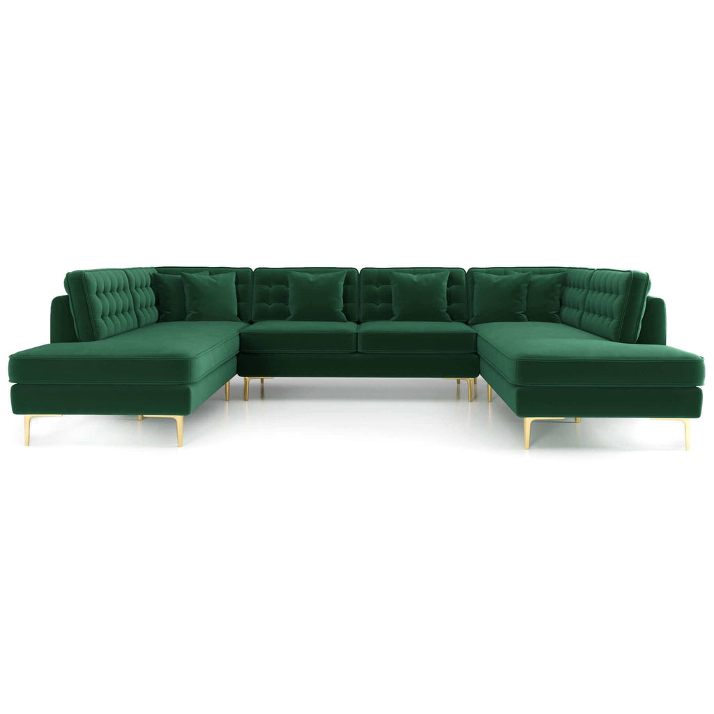 U-shaped sectional sofa in lush green velvet with tufted backrests, accent pillows, and slender gold metal legs.